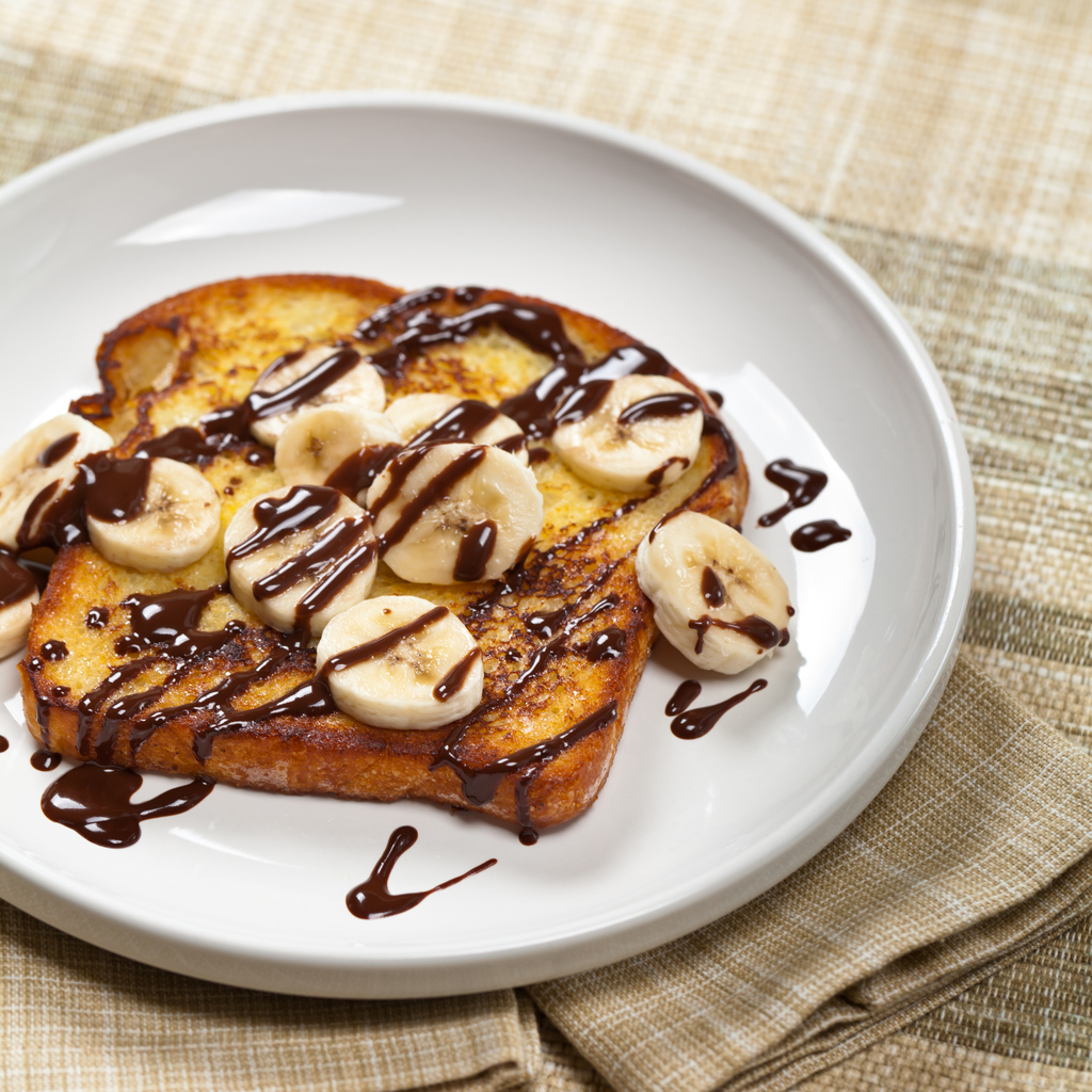 French Toast with Bananas and Chocolate sauce. Selective focus.